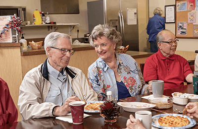 our residents enjoying the dining options at Emerald Heights