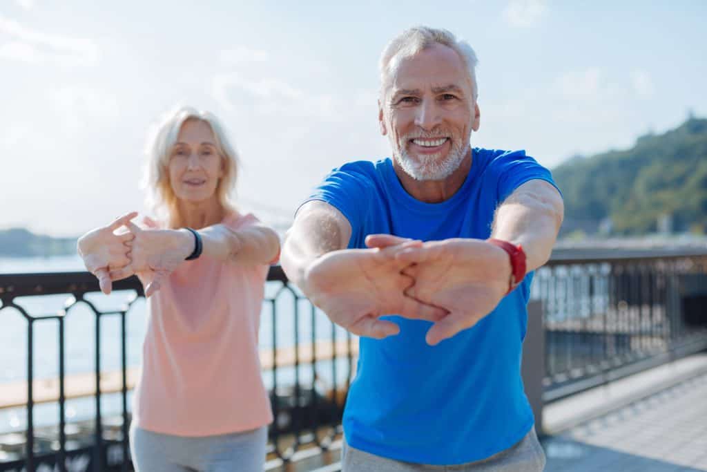 couple stretching to improve vitality